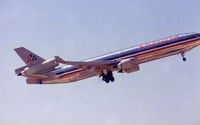N592FE @ DFW - Formerly N1760A - Take off at DFW - Ahh the joys of shooting film...