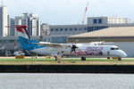 LX-LQJ @ EGLC - Seen at London City Airport, with Think Pink logo on the side of the aircraft.