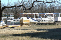 Fort Wolters Helicopters Heliport (88TS) - Unknown F-16 fuselage in a scrap yard near Mineral Wells, TX - by Zane Adams