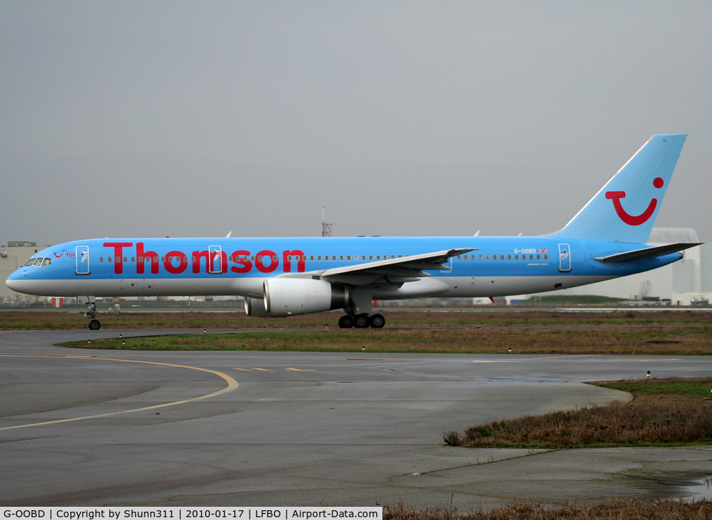 G-OOBD, 2003 Boeing 757-28A C/N 33099, Taxiing holding point rwy 32R for departure in full Thomson Airlines c/s...