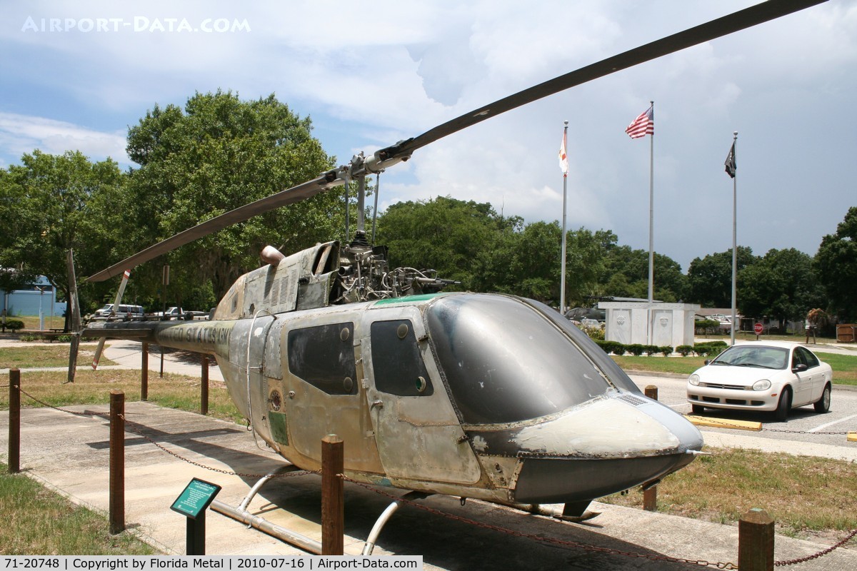 71-20748, 1971 Bell OH-58A Kiowa C/N 41609, OH-58 in veterans Park in Tampa, with a daily Florida thunderstorm forming in background