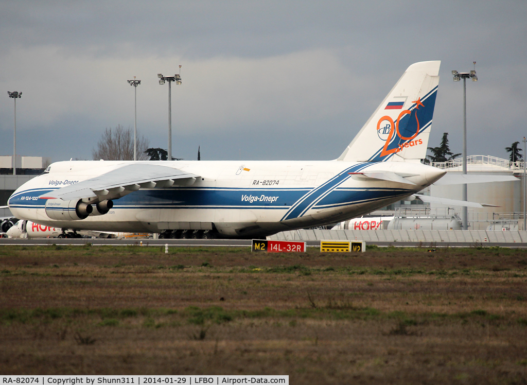 RA-82074, 1994 Antonov An-124-100 Ruslan C/N 9773051459142, Parked at the Cargo apron with additional 20th anniversary sticker on tail