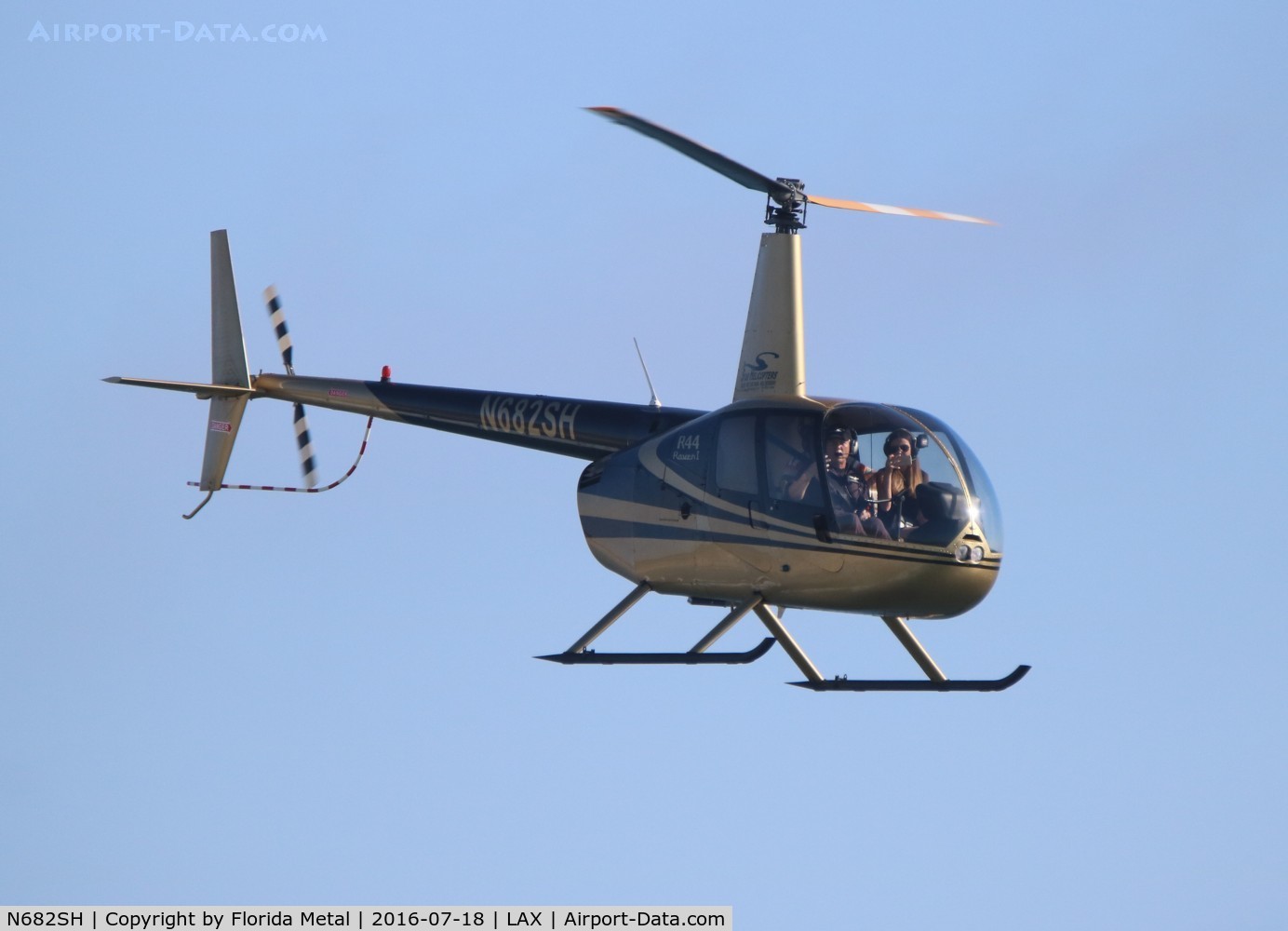 N682SH, 2001 Robinson R44 C/N 1013, Robinson R44 over Dockweiler Beach at the departure end of LAX