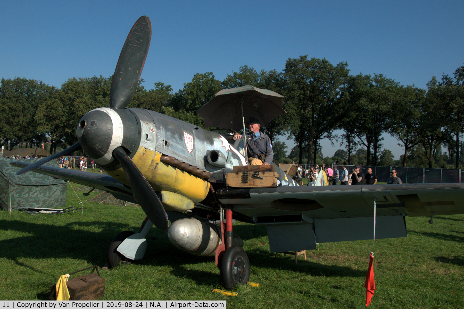 11, Messerschmitt Bf-109G-5 C/N 15343, Restored Messerschmitt Bf 109G-5 at a temporary airfield in a meadow near Ede, the Netherlands. Wings of Freedom air show, 2019. Re-enactor on the wing