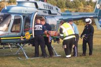 N165SP - Loading motorcycle crash patient - by Peter Tyrrell