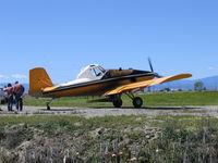 N5021X - Mann and Sons 1975 Rockwell International S2R-T34 at farm airstrip E of Willows, CA between rice seeding flights - by Steve Nation
