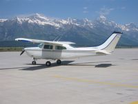 N8823H @ KJAC - 6/2002 Jackson Hole,(KJAC) Jackson Hole, Wyoming - Grand Tetons - (1970 factory paint scheme) - by Phillip Bowers
