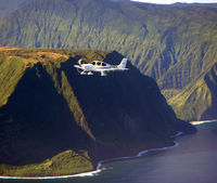 N718LD @ OGG - N718LD over Molokai - by Laurence Balter