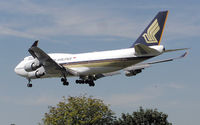 9V-SPB @ LHR - Singapore Airlines Boeing 747-400 (9V-SPB) landing at London (Heathrow) Airport in August 2004 - by Adrian Pingstone