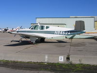 N8462A @ SDM - CMB Maquilla Services 1948 Beech A35 in bright sun at Brown Field (San Diego), CA - by Steve Nation