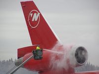 N225NW @ SEA - Northwest Airlines DC-10-30 getting a spray of deicing liquid. - by Andreas Mowinckel