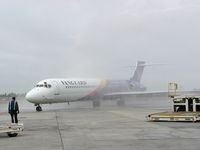 N136NJ @ SEA - Vanguard Airlines operated at SEA between June 3 and July 30, 2002. Photographer was the Station Manager. In picture an MD87 taxiing through the waterarch after the inaugural flight