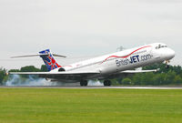 HB-JIB @ EGCC - Smokey touchdown for this Swiss registered, British operated MD-90. - by Kevin Murphy