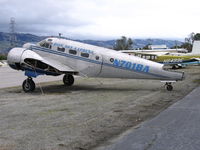 N701BA @ RHV - ex-Blue Sky Express Beech AT-11/C-45 (sans wings) between rainstorms at Reid-Hillview Airport, San Jose, CA - by Steve Nation