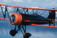 N12332 - Vern Dallman flying his Curtiss-Wright Travel Air B-14-B over Lake Tahoe on Easter morning in the late 1980s. - by Deborah Richardson, Poulsbo, WA