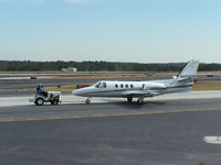 N999PW @ PDK - Tug 2 getting ready to move aircraft - by Michael Martin
