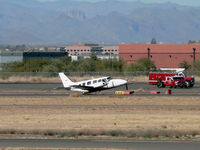 N494SC @ DVT - Left main gear would not extend, so the pilot opted for a wheels-up landing. - by John Meneely
