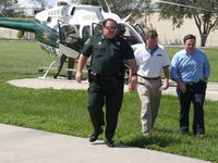 N407KB @ NONE - Congressman Feeney, Sheriff Beary and Congressman Keller after touring areas damaged by Hurricanes Charley and Frances. This image is a work of a U.S. House of Representatives employee, taken or made during the course of an employee's official duties. As - by U.S. House of Representatives