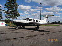 N7779T @ 77G - On the ramp at 77G - by Ted Huntoon