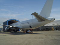 N310AN @ KPAE - Loading for ferry from KPAE to CYUL. Boxes being loaded in aft cargo bay are aircraft logs and records - 1200 lbs. Pilots Bruce Burns and John Boling - by John J. Boling