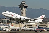JA8074 @ LAX - Japan Airlines Sky Cruiser departing RWY 25R, passing in front of the control tower on a clear day in December.