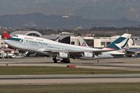 B-HOV @ LAX - Cathay Pacific B-HOV departing RWY 25R on a clear day in Decmeber. - by Dean Heald