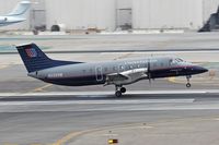 N229SW @ LAX - United Express N229SW touching down on RWY 7R at LAX.