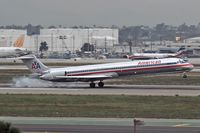 N7512A @ LAX - American Airlines N7512A touching down on RWY 7R. - by Dean Heald