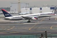 N657DL @ LAX - Delta Airlines N657DL touching down on RWY 7R.