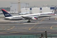 N657DL @ LAX - Delta Airlines N657DL touching down on RWY 7R. - by Dean Heald