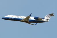 N979SW @ LAX - United Express N979SW climbing out from LAX RWY 25R. - by Dean Heald