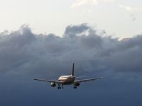 UNKNOWN @ LAS - I forgot to note what airline it was. The storm in the background produced some unbelievable wind gusts. - by SkyNevada