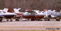 N13078 @ PVG - Populating the large parking ramp, near the commercial hangars