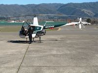 N2304W @ UKI - 1991 Robinson R22 Beta gets look see from CALSTAR pilot at Ukiah, CA - by Steve Nation
