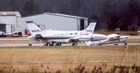 N911PJ @ PVG - Seen from the service road, parked near the fuel pit - by Paul Perry