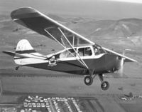 N4541E @ CCR - Pete Bowers flying over Concord CA Jan 1950. - by Bill Larkins