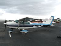 N3166R @ HWD - 1967 Cessna 182L at stormy Hayward Air Terminal, CA - by Steve Nation