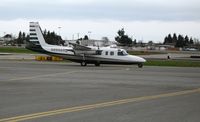 N690AR @ HWD - Aero Commander 690A taxying in at stormy Hayward Air Terminal, CA - by Steve Nation
