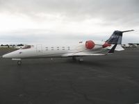 N131TR @ HWD - 2001 Learjet 60 at stormy Hayward Air Terminal, CA - by Steve Nation