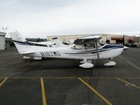 N182BG @ HWD - Spanking new 2006 Cessna 182T at stormy Hayward Air Terminal, CA - by Steve Nation