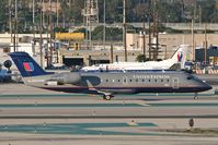 N944SW @ LAX - United Express N944SW taxiing to the terminal after arrival. - by Dean Heald
