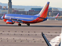N455WN @ KLAS - Southwest Airlines / 2004 Boeing 737-7H4 / Stupid fence with garbage stuck in it! - by SkyNevada