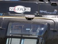 N969W @ RIU - close-up of San Joaquin Helicopters titles on 1978 Bell 206B between lifting firefighters to mountain blaze @ Rancho Murieta Airport, CA - by Steve Nation