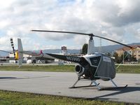 N63990 @ SQL - 1987 Robinson R22 BETA ready for liftoff @ San Carlos Airport, CA in rare spring 2006 sunshine - by Steve Nation
