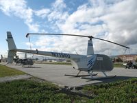 N7194U @ SQL - Felicty Air 2001 Robinson R44 under wraps @ San Carlos Airport, CA in rare spring 2006 sunshine - by Steve Nation