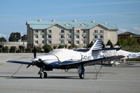 N5424D @ SQL - 2000 Commander Aircraft 114TC under wraps @ San Carlos Airport, CA in rare spring 2006 sunshine - by Steve Nation