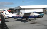 N684MC @ SQL - 1976 Cessna T210M under wraps @ San Carlos Airport, CA in rare spring 2006 sunshine - by Steve Nation