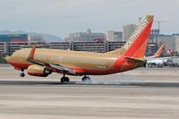 N749SW @ LAS - Southwest N749SW - 1999 Boeing 737-7H4 (FLT SWA1358) touching down on RWY 25L, concluding a 41-minute flight from Phoenix Sky Harbor Int'l (KPHX) - Phoenix, Arizona.