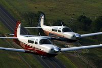 N1036R @ 83TX - N1036R is in the foreground with another Ovation 2 shortly after manufacture in Kerrville - by Alex Melia