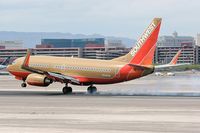 N749SW @ LAS - Southwest N749SW - 1999 Boeing 737-7H4 (FLT SWA1358) touching down on RWY 25L, concluding a 41-minute flight from Phoenix Sky Harbor Int'l (KPHX) - Phoenix, Arizona.